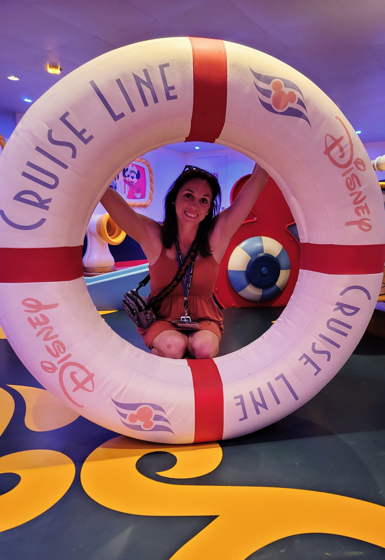 Jenn Lalonde inside a Disney Cruise Line life ring on the Disney Wish