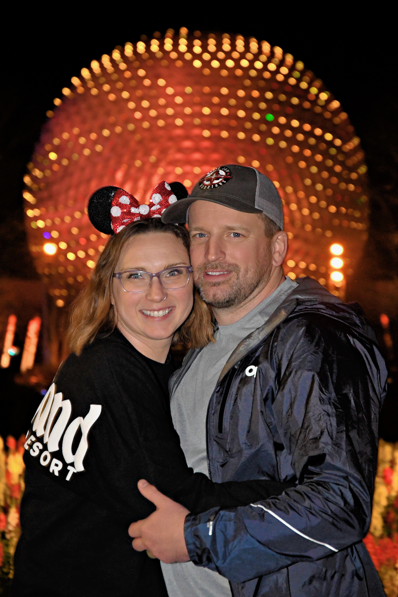 Krystal Moore with her husband in front of EPCOT at night