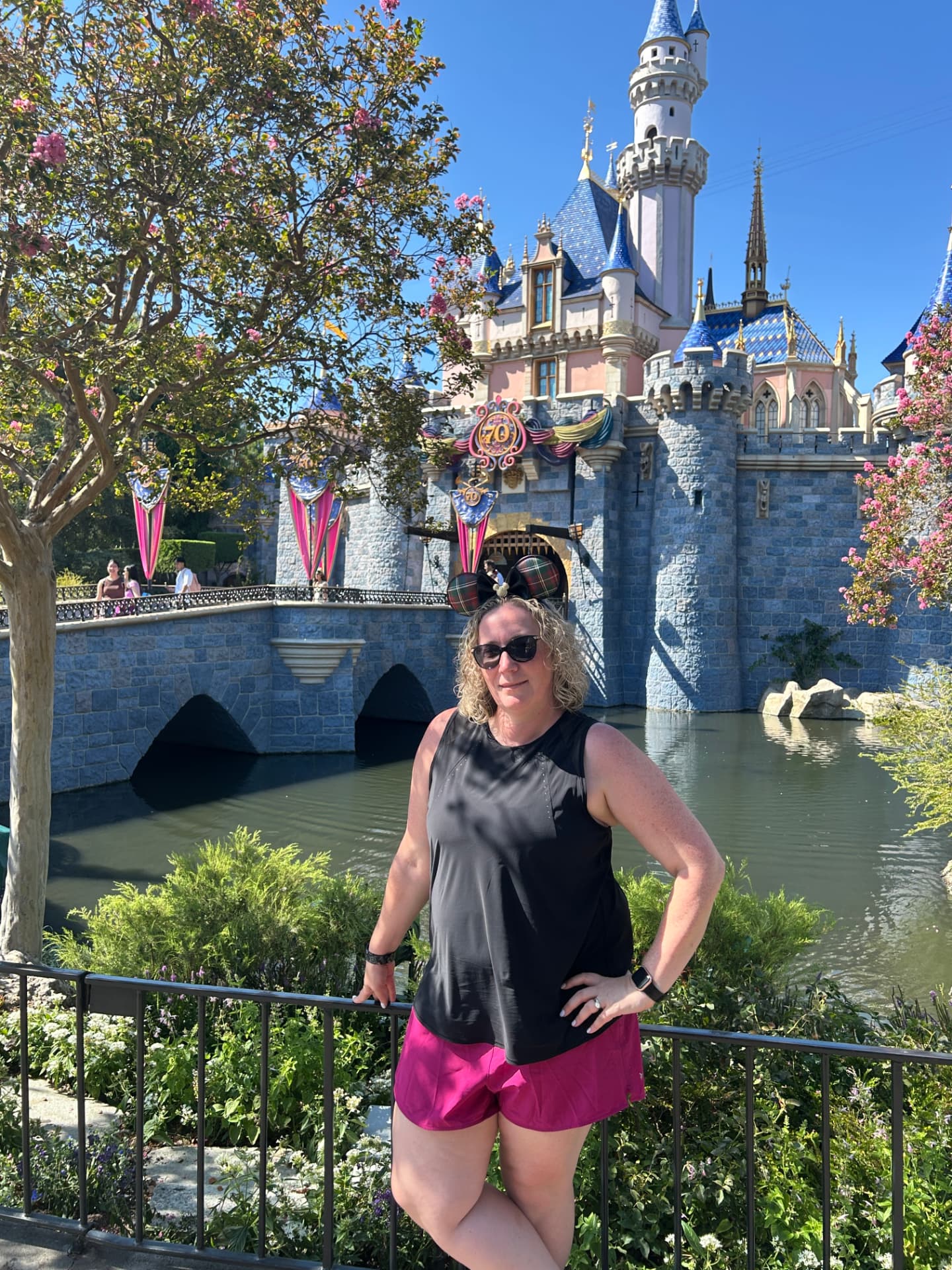Jade Gambicourt at Sleeping Beauty Castle during Disneyland's 70th celebration