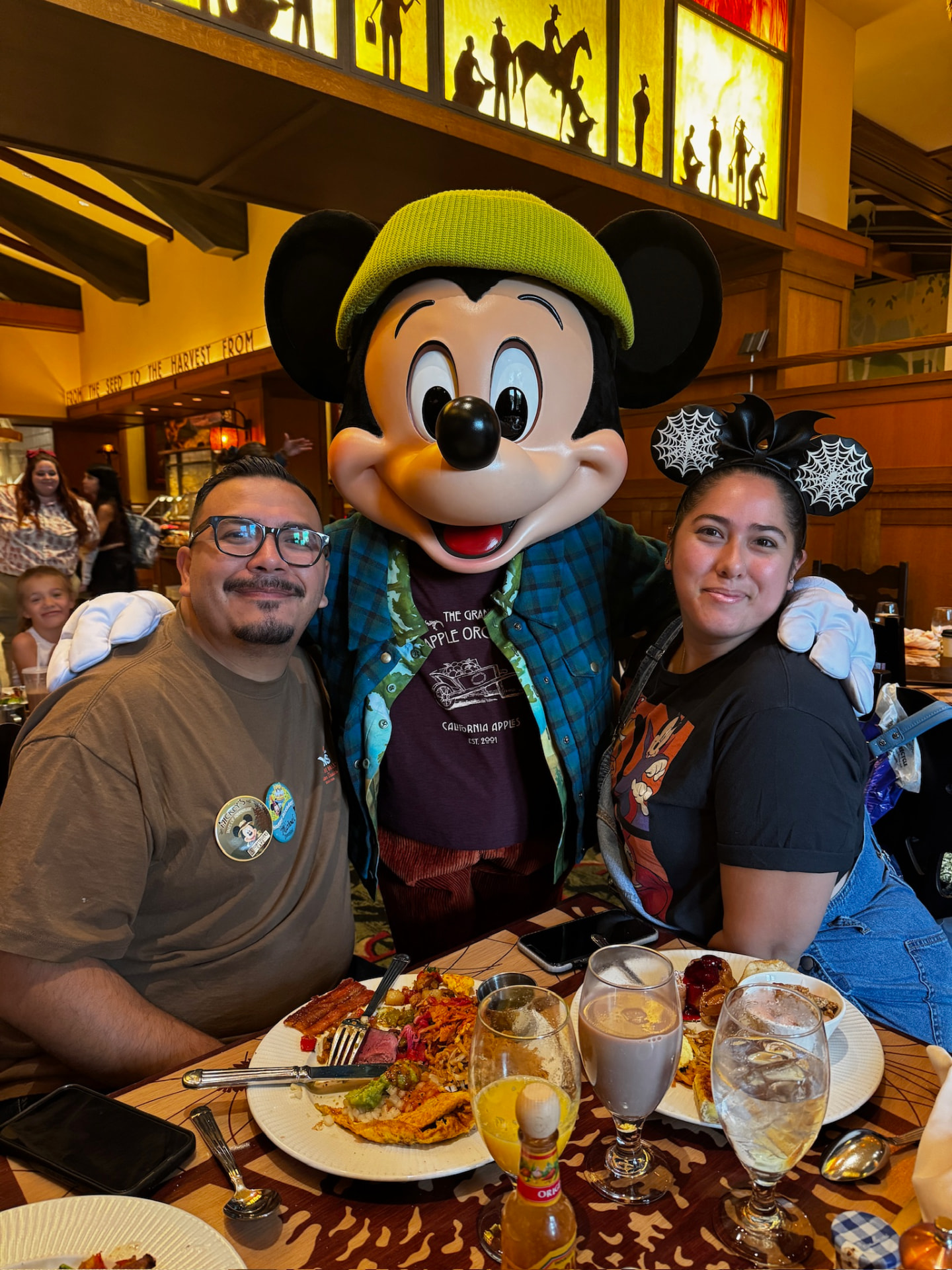 Debbie Anchondo and her partner dining with Mickey Mouse