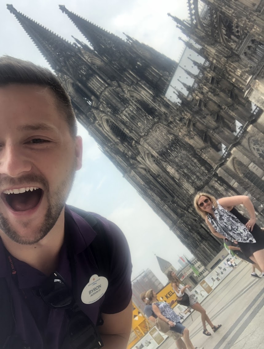 Lori with an Adventures by Disney guide in front of Cologne Cathedral