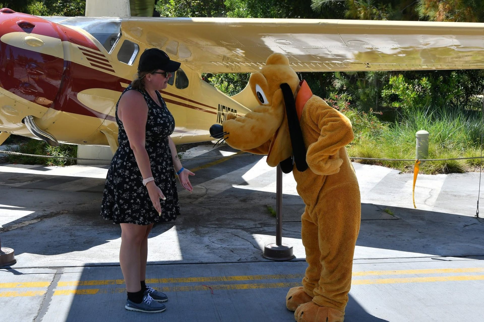 Jen meeting Pluto at Disneyland