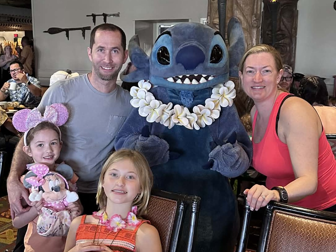 Mandy and her family with Stitch at a character breakfast