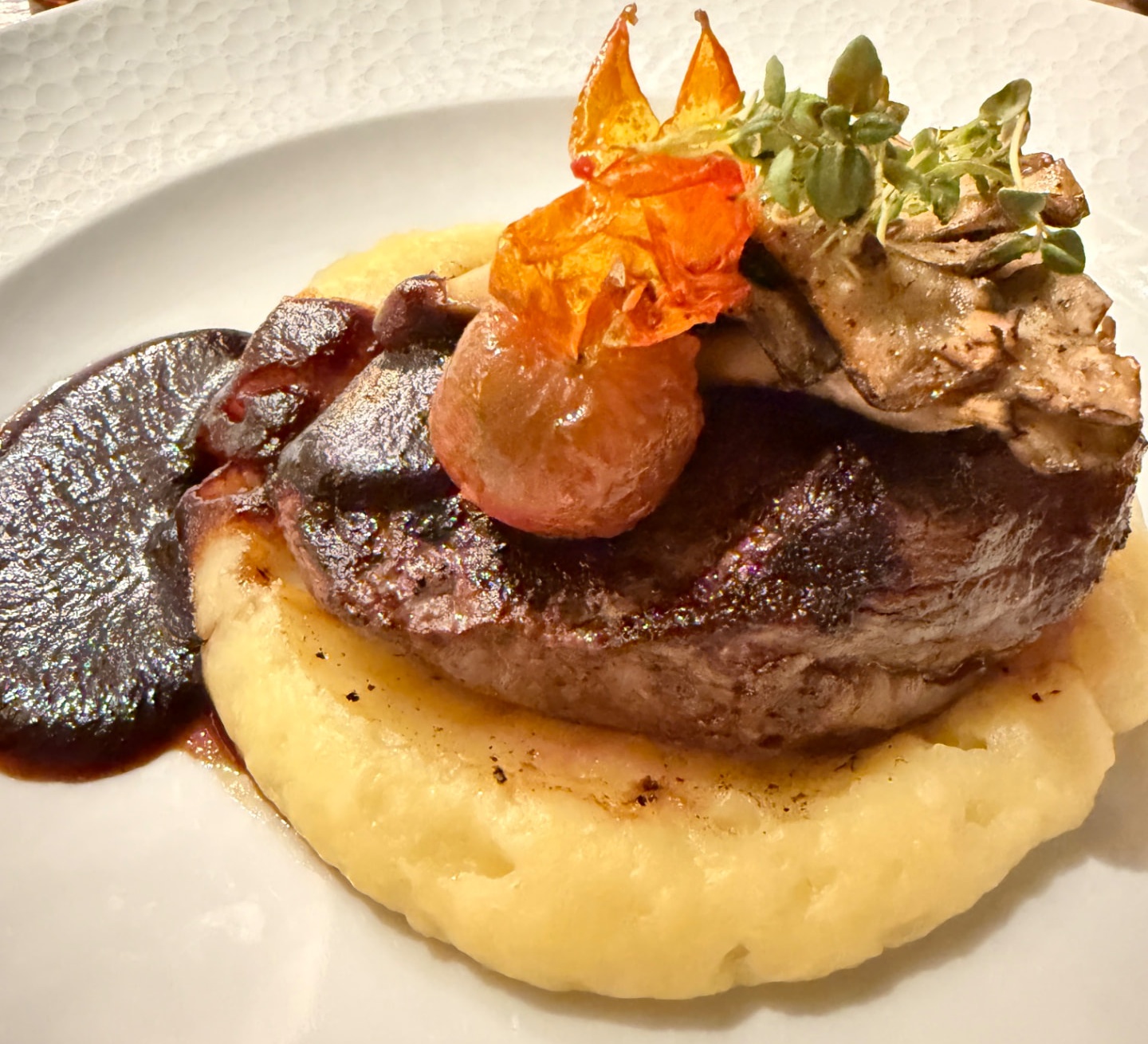 Plated steak dinner at Toledo, the rooftop restaurant at Disney's Coronado Springs Resort