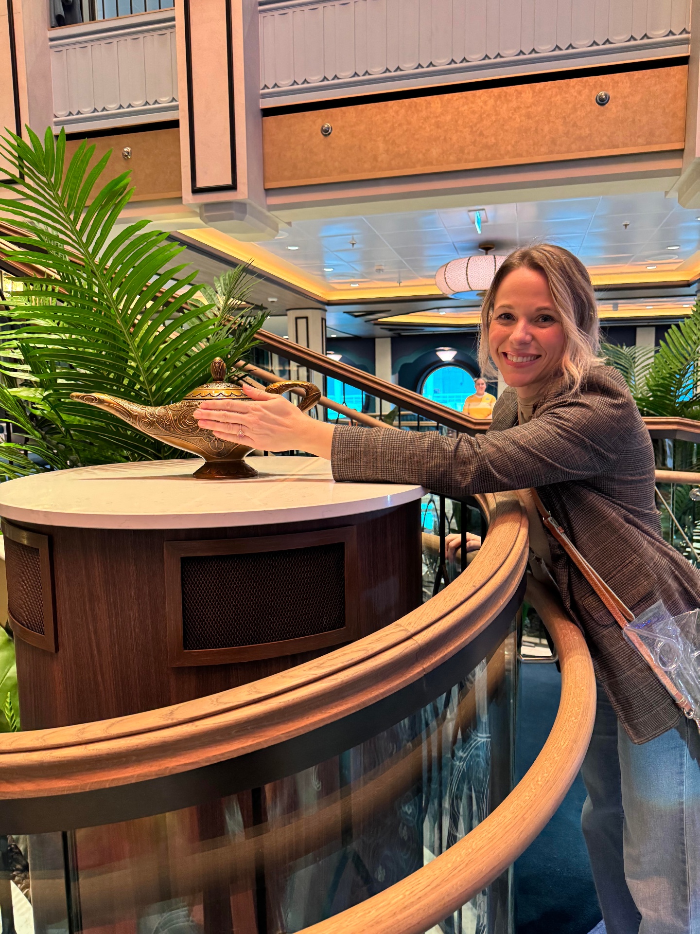 Michelle aboard the Disney Treasure with the Aladdin lamp