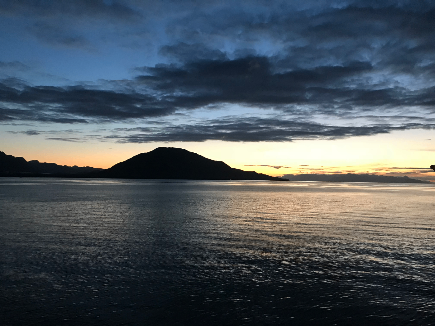 Alaska sunset over calm water during a Disney Cruise
