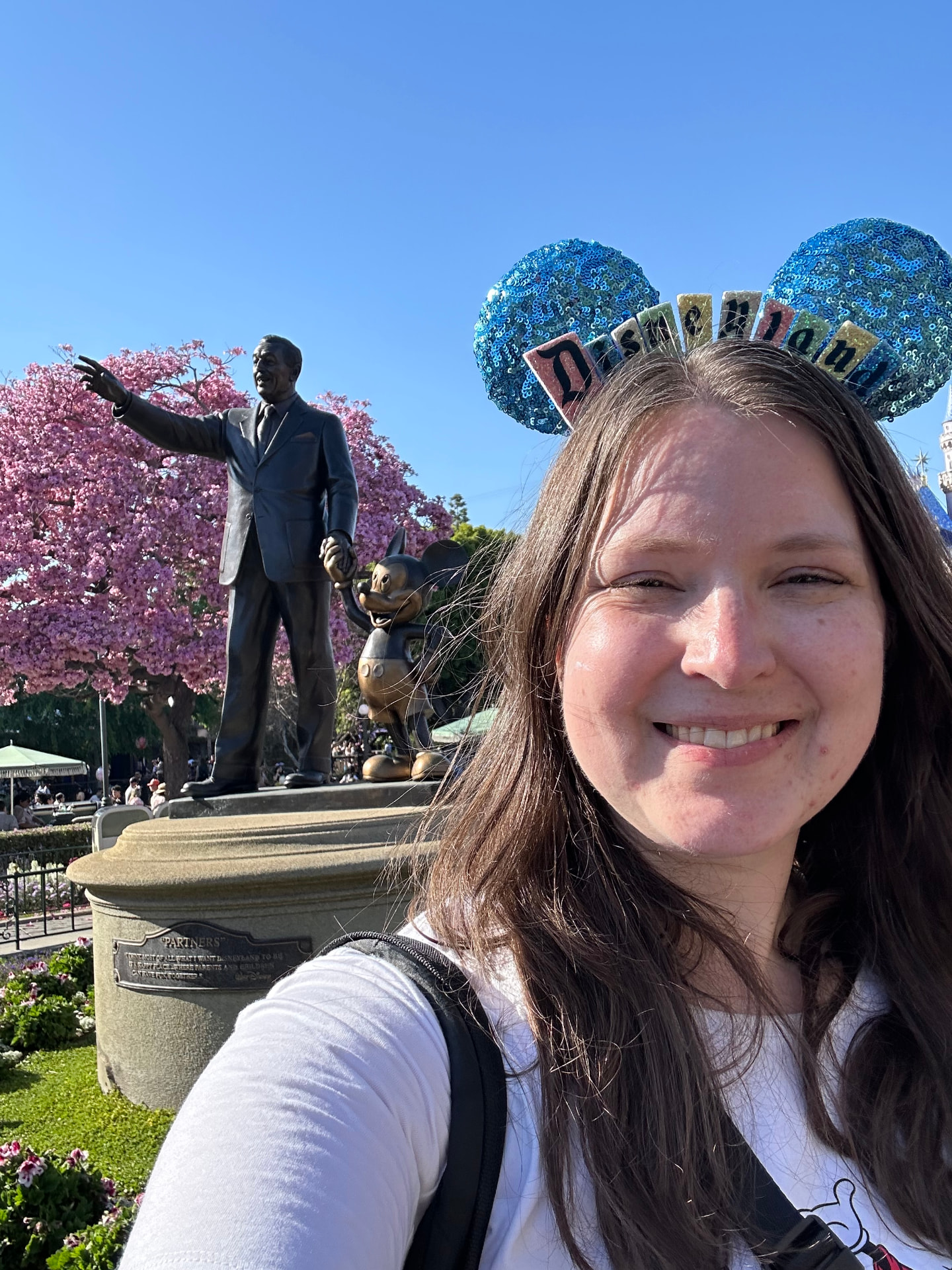 Kathryn beside the Partners statue at Disneyland Park