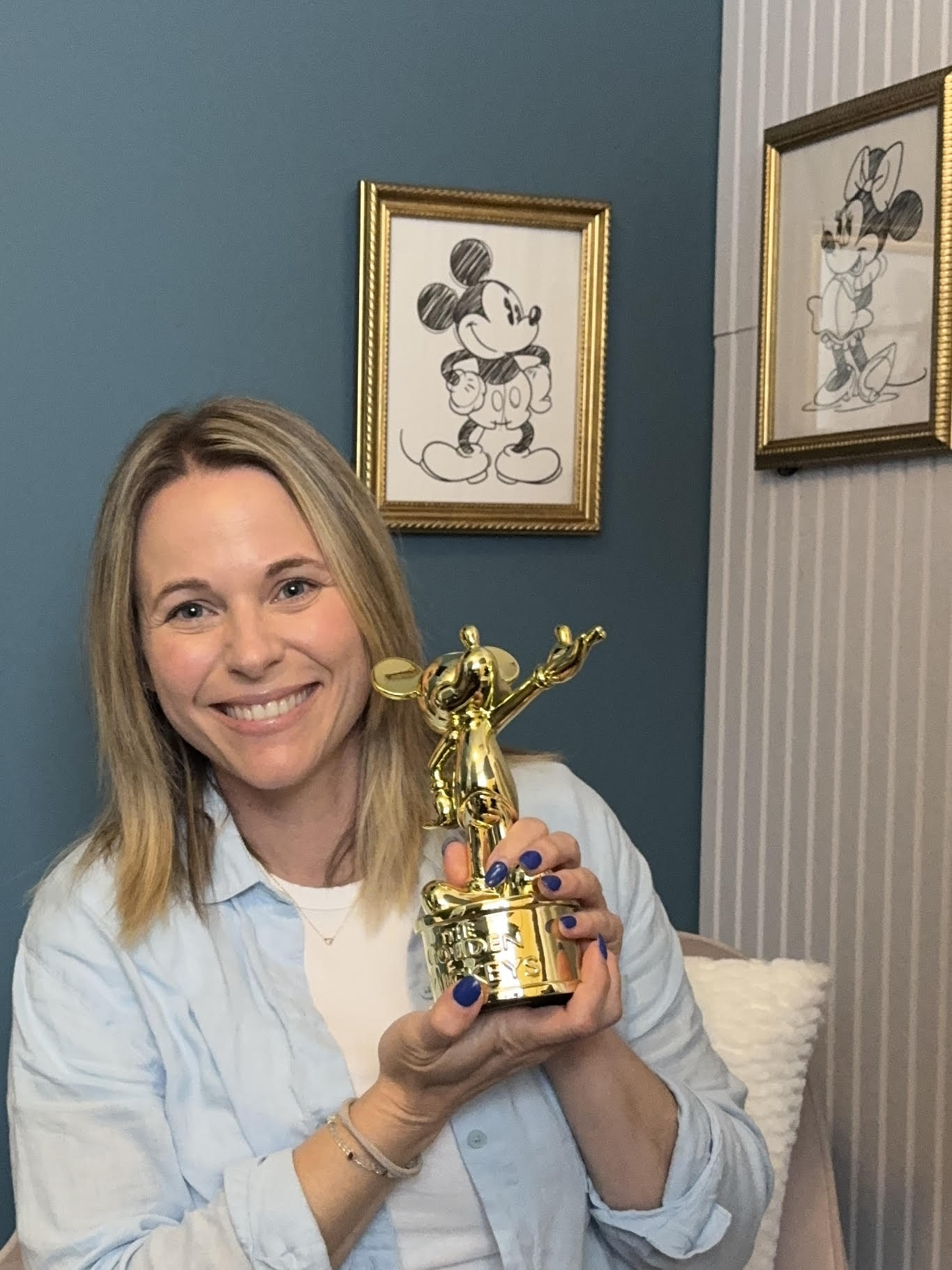Michelle holding her Golden Mickey award