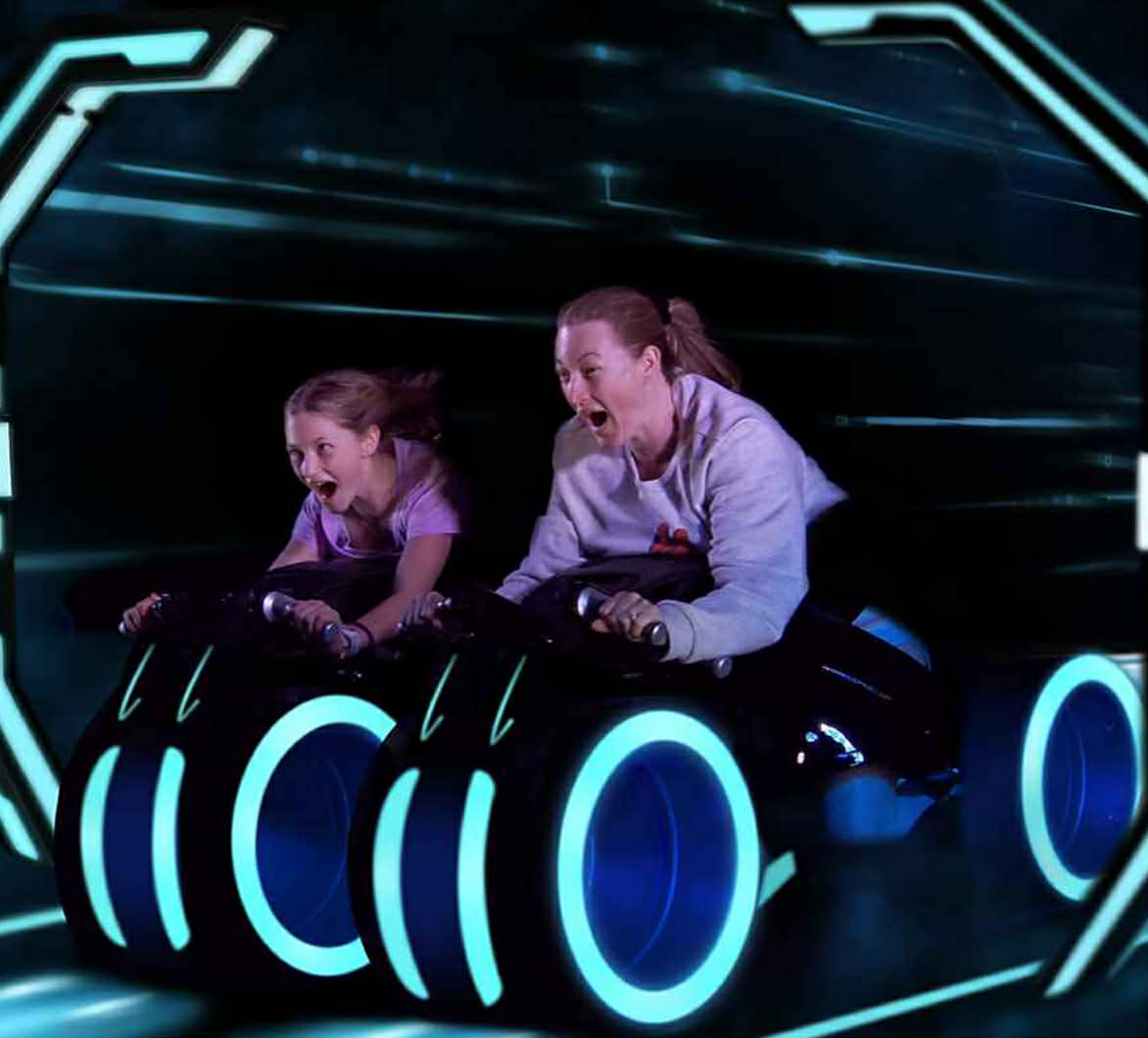 Mandy and her daughter riding TRON Lightcycle Run at Magic Kingdom