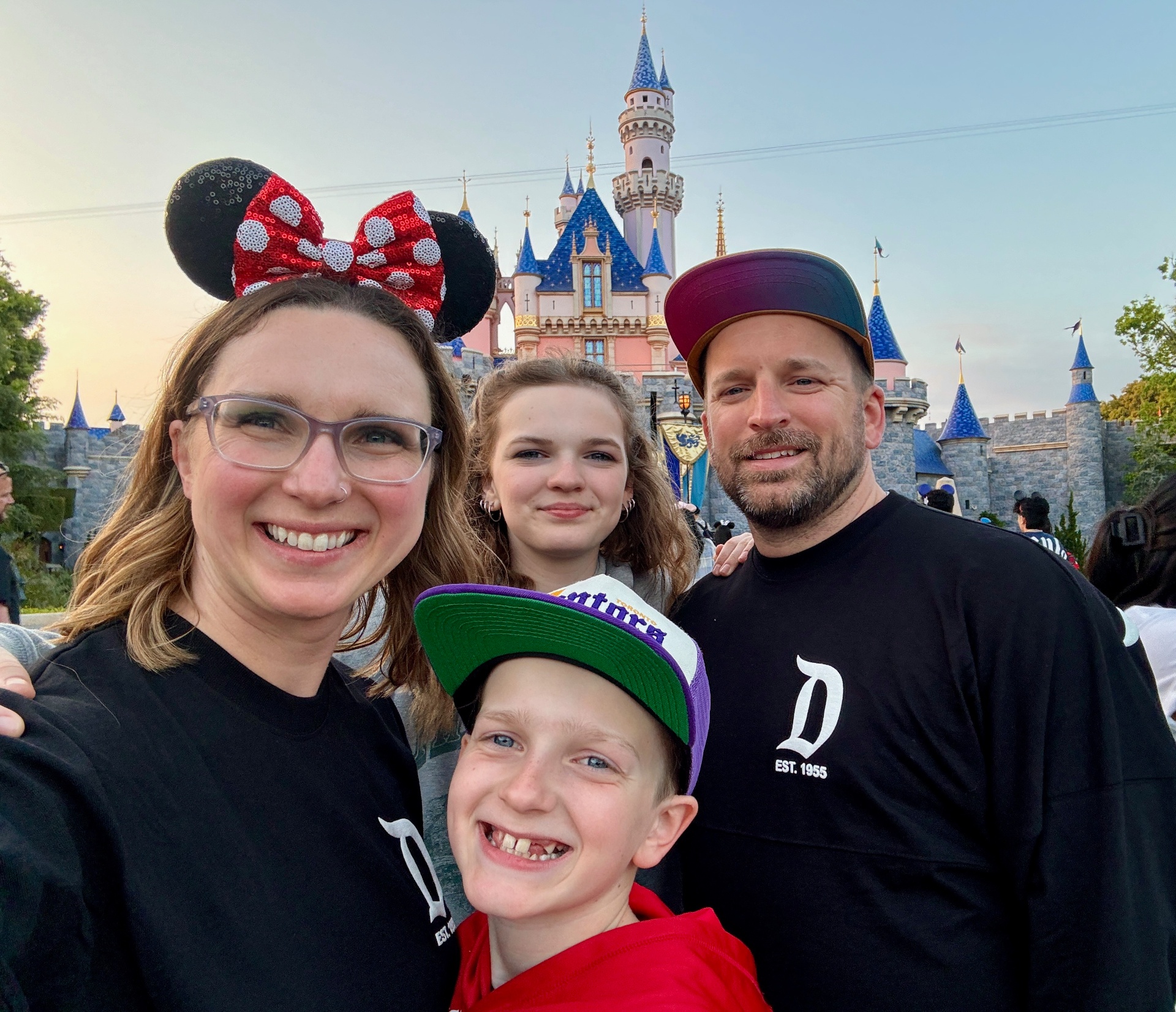 Krystal Moore and her family on their first visit to Disneyland in front of Sleeping Beauty Castle
